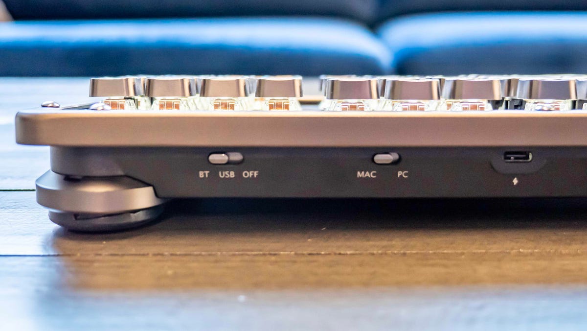 The back of the Azio RC Prestige keyboard has a USB-C port for charging and a wired connection to a computer. There are also switches to change to using a Bluetooth connection and changing the OS support between Windows or MacOS.