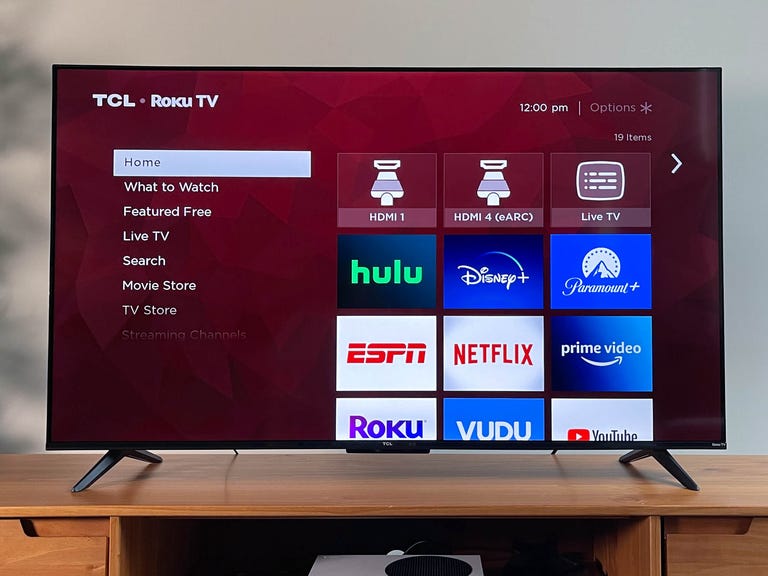 TCL 4 Series Roku TV on a stand
