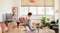 Woman exercising in her living room.