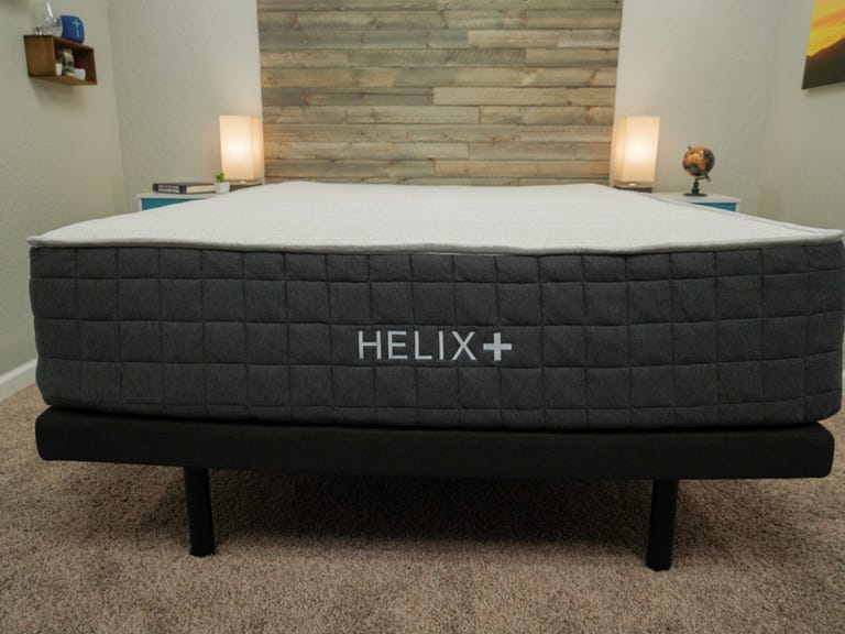 The Helix Plus Mattress in a queen size on top of a bed frame