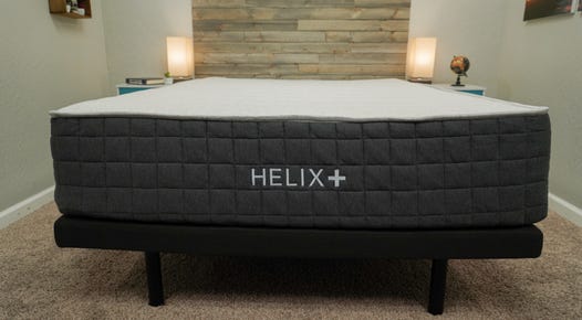 The Helix Plus Mattress in a queen size on top of a bed frame