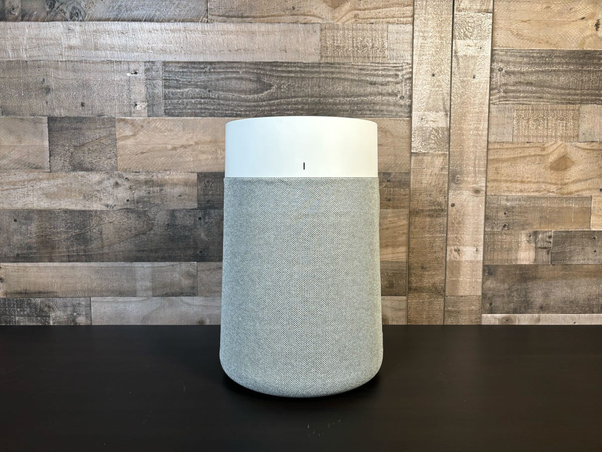 The BlueAir Blue Pure 311i Max air purifier sits on a table in front of a wooden wall. It's CNET's top-rated air purifier for medium-sized spaces, and our top overall pick for most shoppers.