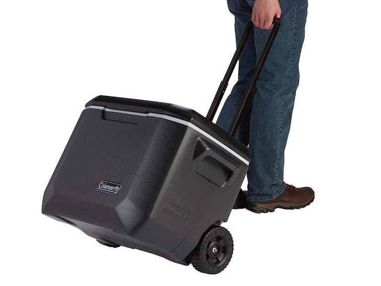 Person pulling coleman cooler