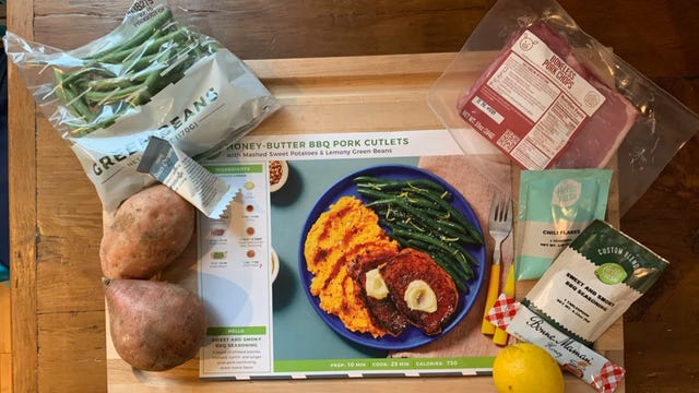 Hellofresh meal kit laid out on cutting board.