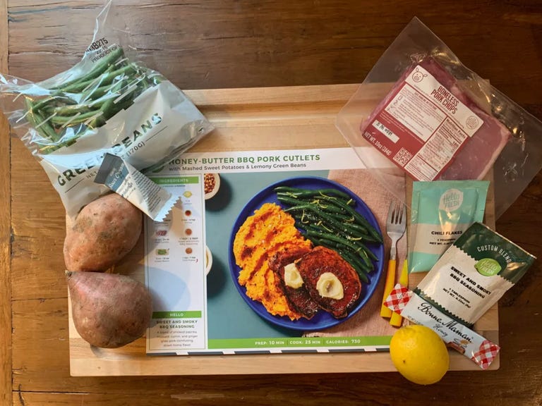 Hellofresh meal kit laid out on cutting board.