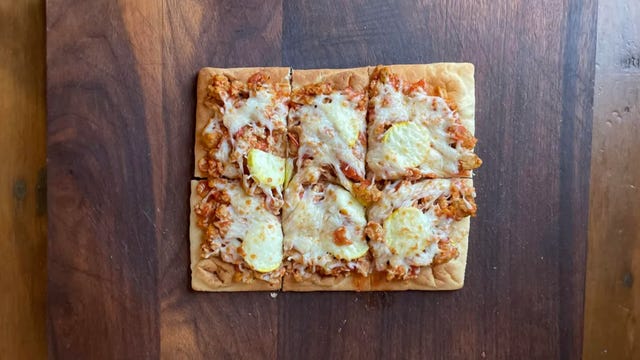 flatbread pizza on cutting board